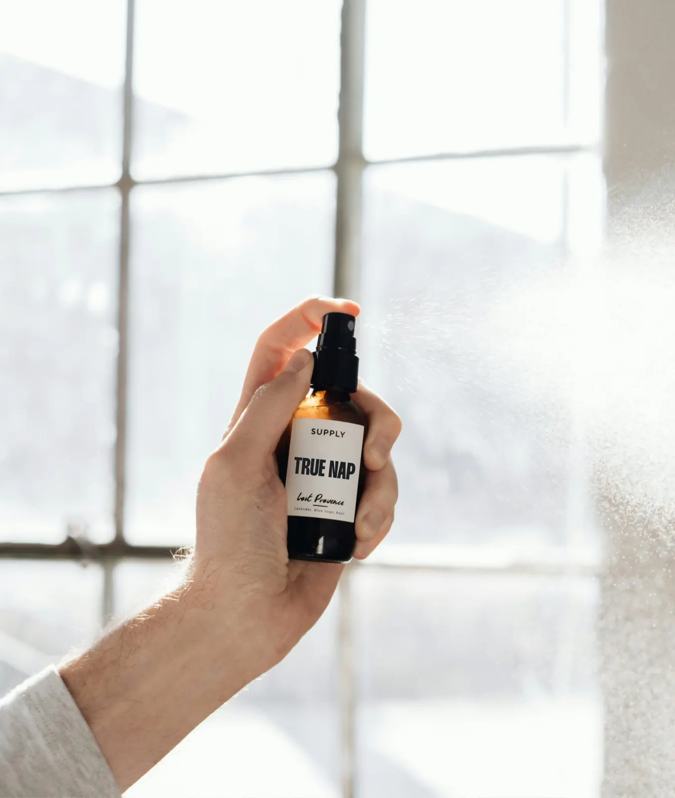 TRUE NAP sleep spray in hand